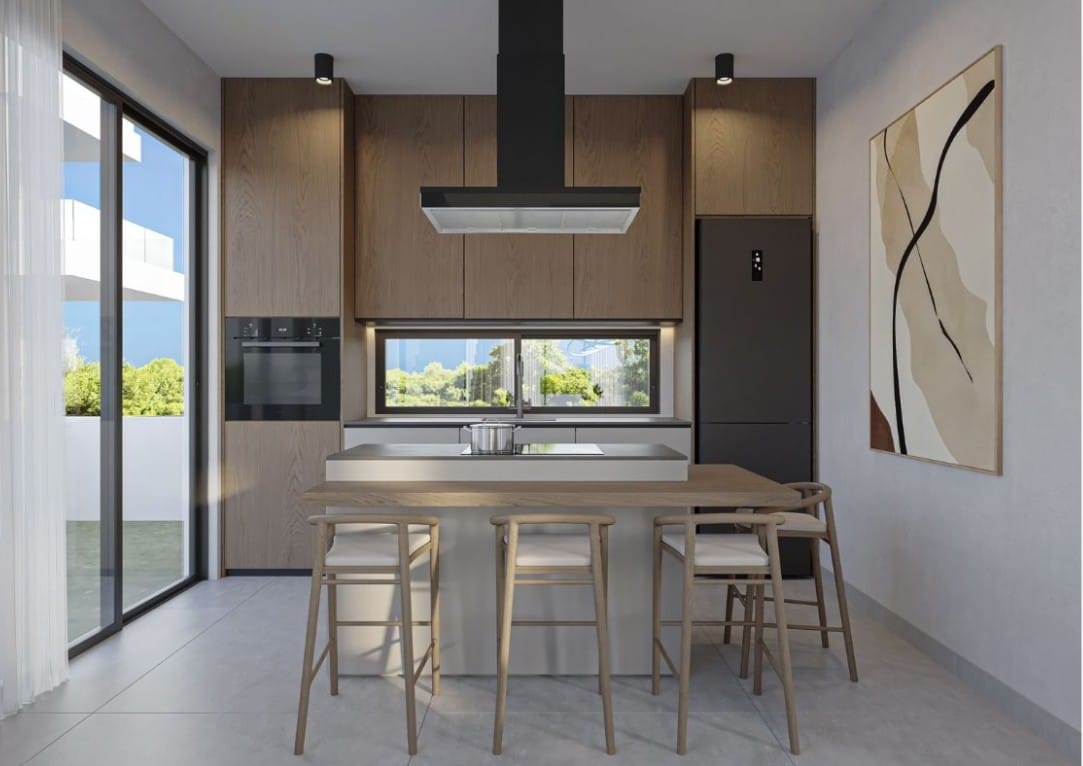 Kitchen with island and dining seating in the Kissonerga detached house