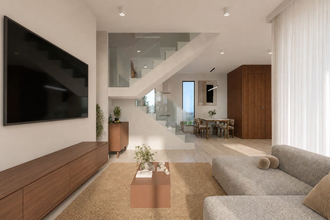 Open-plan living and dining area with staircase in the Geroskipou Coast villa