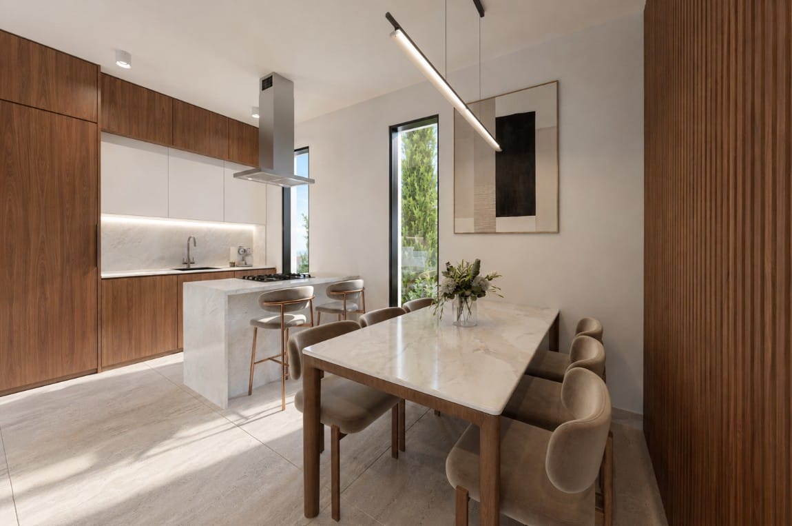 Kitchen with island and dining table in the Geroskipou Coast villa