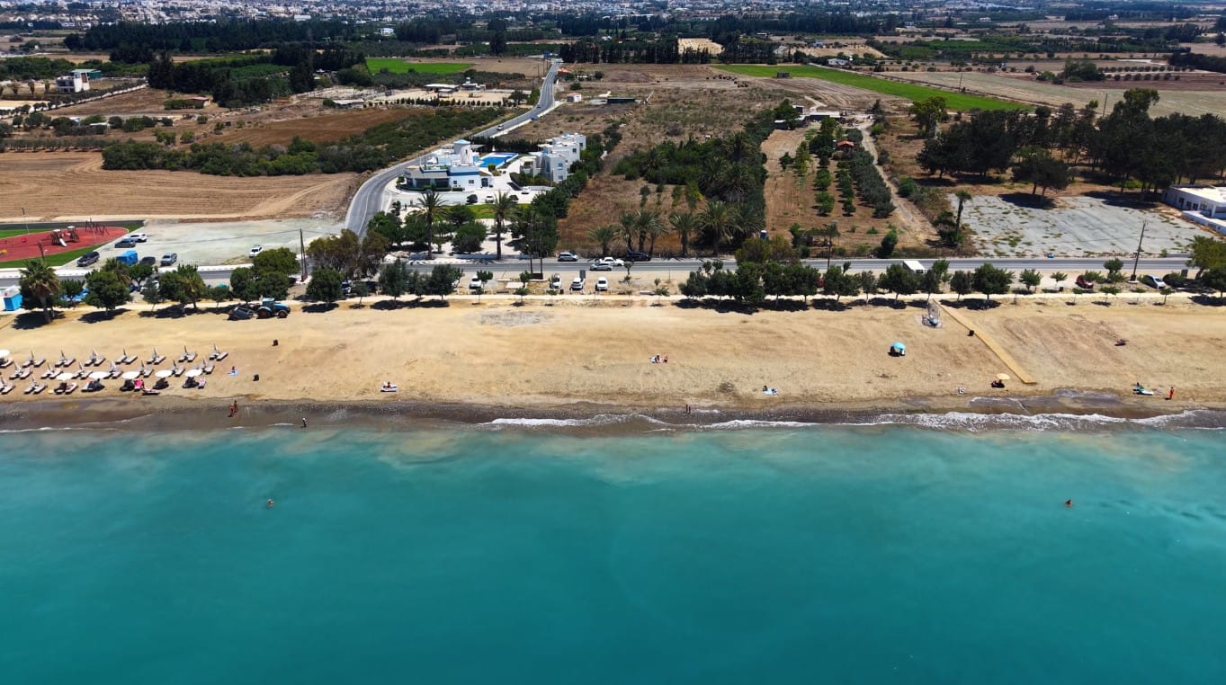 Aerial view of the beach and coastal road at Geroskipou Coast, Paphos