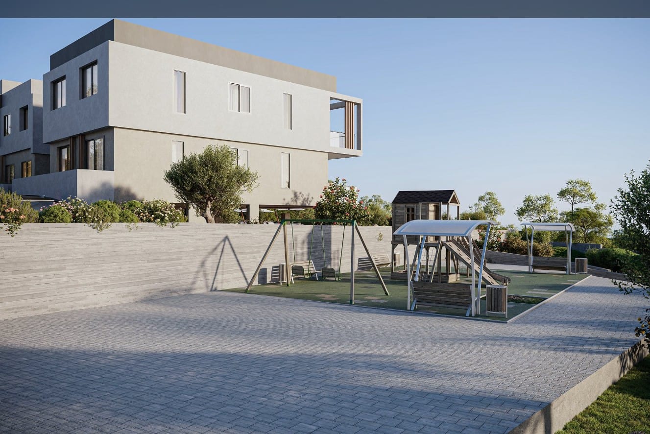 Children's playground and landscaped communal area at residential development in Tremithousa