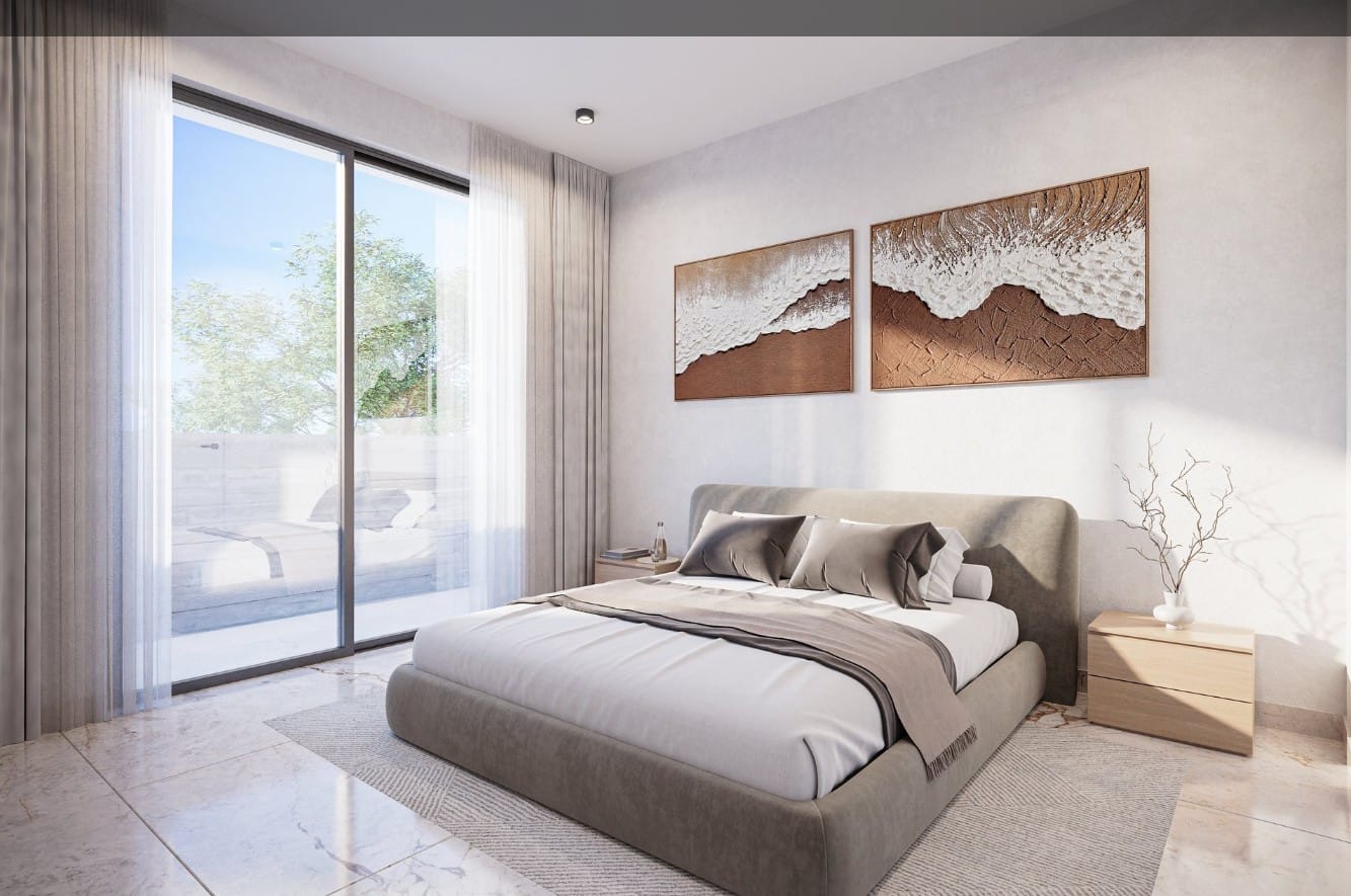 Bedroom with sliding doors to the veranda in a Tremithousa apartment