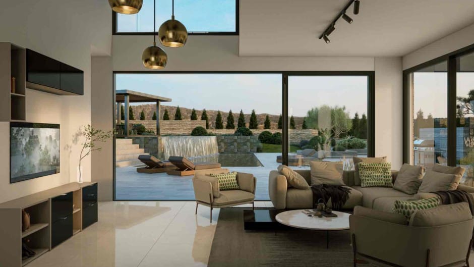 Open-plan living area with full-height glazing opening onto the private swimming pool and outdoor terrace