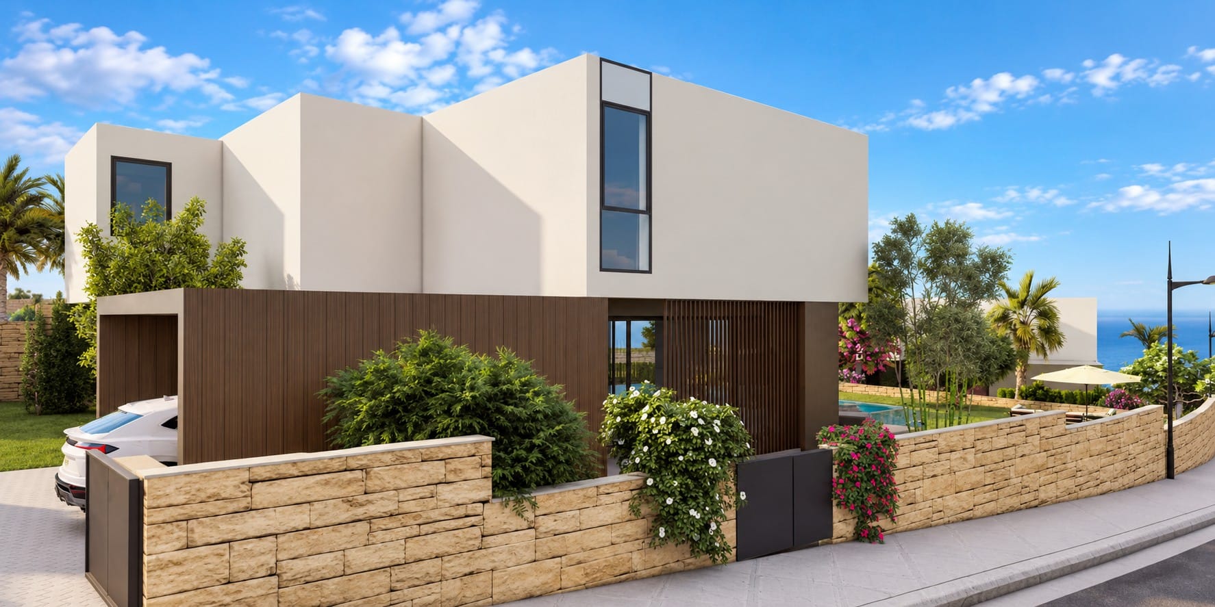 Street-side exterior of a contemporary villa in Peyia, Paphos, with timber-clad ground floor, covered parking, stone boundary wall and a glimpse of the Mediterranean Sea