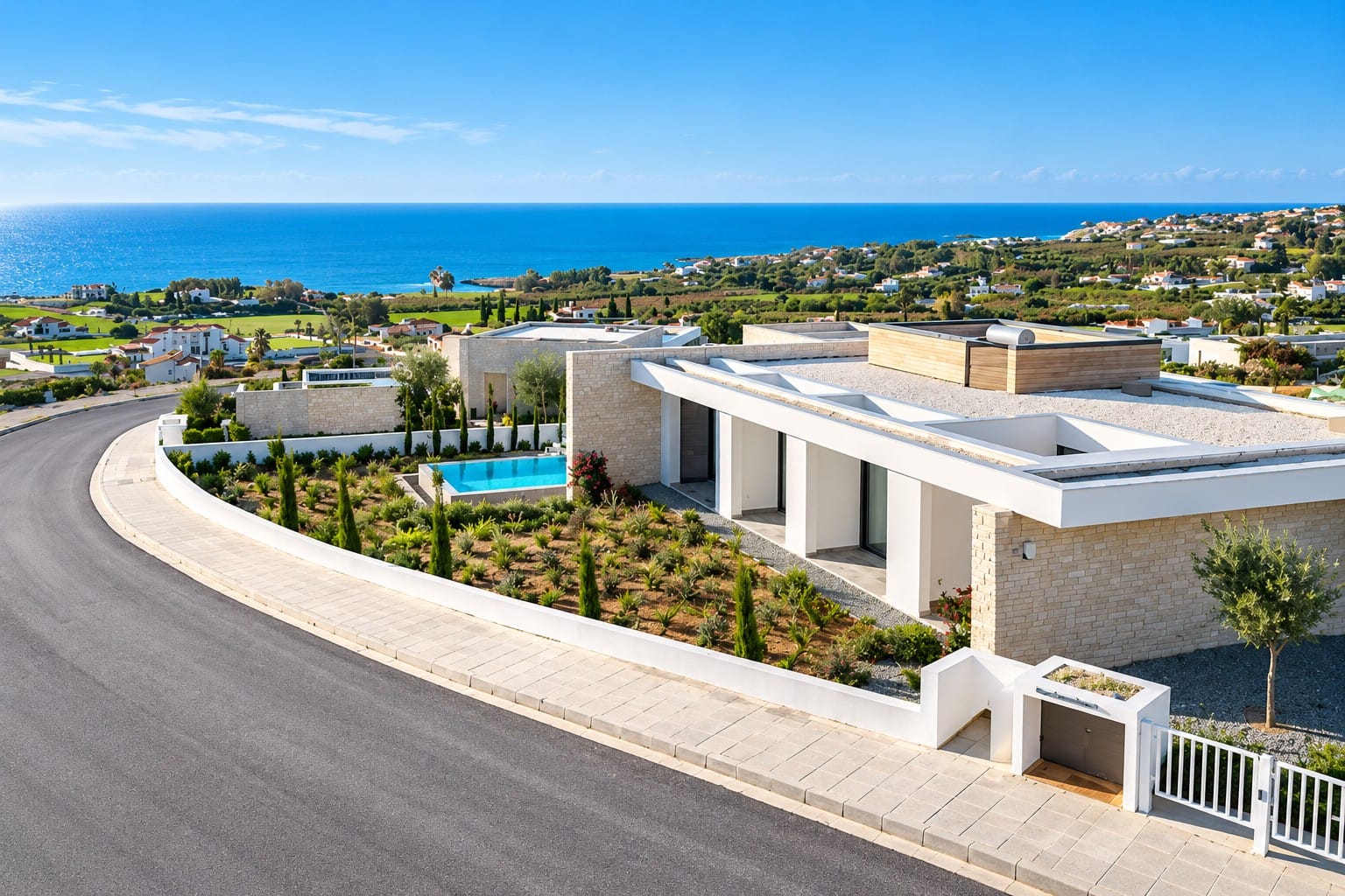 Street-side view of a single-level villa in Sea Caves, Paphos, with landscaped garden, private swimming pool and Mediterranean Sea views