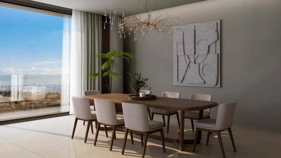 Dining area with floor-to-ceiling windows at villa in Agios Athanasios, Limassol