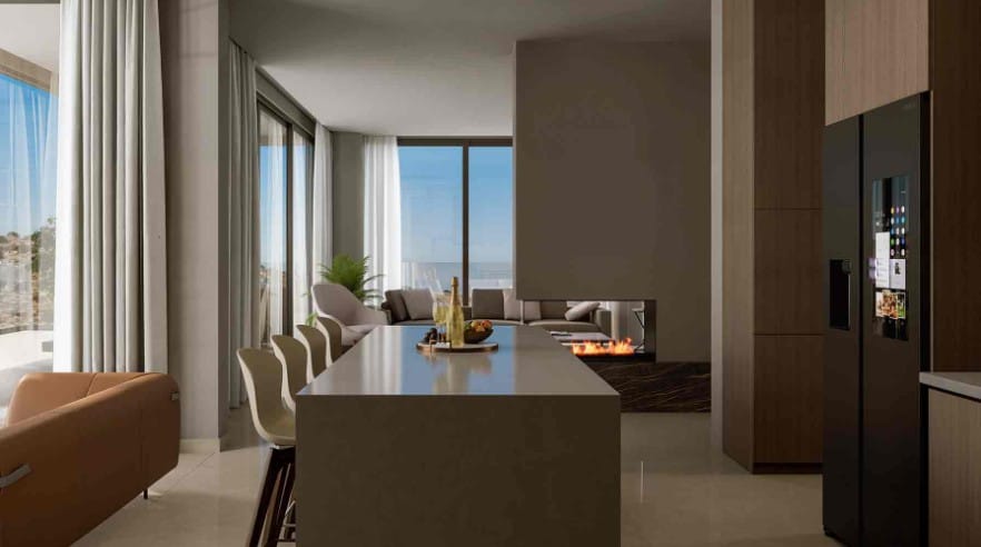 Kitchen island and fireplace at villa in Agios Athanasios, Limassol